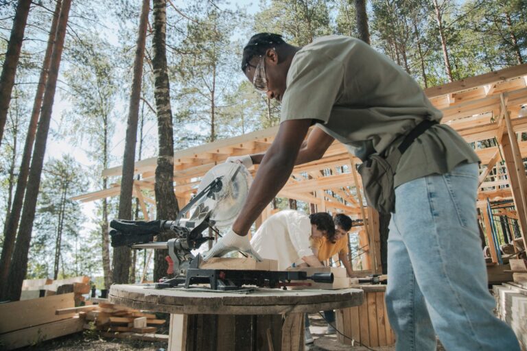 a man cutting wood using circular saw